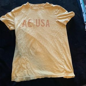mustard yellow american eagle shirt